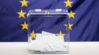 transparent-ballot-box-filled-with-white-envelope-european-union-flag (1)