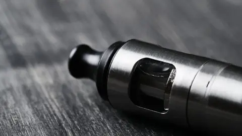 Vaping device on the wooden table
