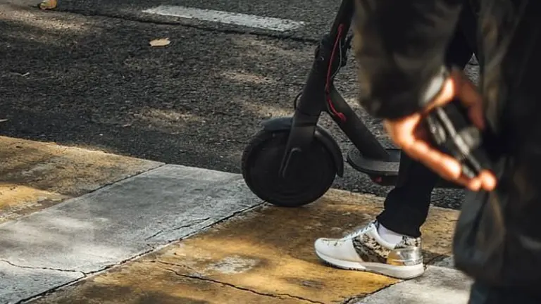 person-about-to-ride-electric-kick-scooter_opt